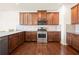 Beautiful kitchen featuring granite countertops, stainless appliances, and hardwood floors at 3750 Lake Haven Way, Atlanta, GA 30349