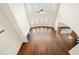 Open concept living room with fireplace, hardwood floors, and plenty of natural light at 3750 Lake Haven Way, Atlanta, GA 30349