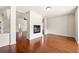 Open-concept living room with hardwood floors and fireplace at 3750 Lake Haven Way, Atlanta, GA 30349