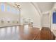 Open living room with hardwood floors, soaring ceilings, large windows, and natural light at 3750 Lake Haven Way, Atlanta, GA 30349