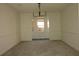 Open dining room with elegant wainscoting, neutral paint, and a modern chandelier fixture at 4631 Calumet Cir, Duluth, GA 30096