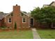 Charming brick home with well-manicured lawn and lush landscaping, featuring a brick chimney at 4631 Calumet Cir, Duluth, GA 30096