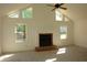 Bright living room with vaulted ceilings, a cozy fireplace, and ample natural light from large windows at 4631 Calumet Cir, Duluth, GA 30096