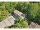 Aerial view of the townhome surrounded by lush greenery and trees at 482 Pearl Cove Ct, Atlanta, GA 30350