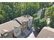Aerial view showcasing well-maintained townhomes surrounded by lush trees at 482 Pearl Cove Ct, Atlanta, GA 30350