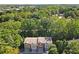 Aerial view of the house in a neighborhood surrounded by lush greenery at 482 Pearl Cove Ct, Atlanta, GA 30350
