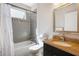 Bathroom featuring a bathtub with shower and a granite vanity at 482 Pearl Cove Ct, Atlanta, GA 30350