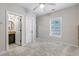 Bright bedroom with attached bathroom, large window, and neutral carpeting at 482 Pearl Cove Ct, Atlanta, GA 30350