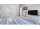 Comfortable bedroom with neutral decor, plush carpeting, and storage closet at 482 Pearl Cove Ct, Atlanta, GA 30350