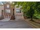 Beautiful exterior elevation of a brick townhome with a private garage at 482 Pearl Cove Ct, Atlanta, GA 30350