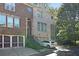 Beautiful townhome exterior with brick facade, attached garages, and well-maintained landscaping at 482 Pearl Cove Ct, Atlanta, GA 30350