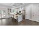 Bright kitchen with stainless steel appliances, stone island and ample cabinet space at 482 Pearl Cove Ct, Atlanta, GA 30350