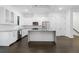 Bright and open kitchen featuring stainless steel appliances and a center island at 482 Pearl Cove Ct, Atlanta, GA 30350