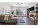 Inviting living room featuring a cozy fireplace, built-in shelving, and a comfortable gray sectional at 482 Pearl Cove Ct, Atlanta, GA 30350