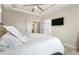 A well-lit main bedroom offers a large bed, tray ceiling, and easy access to walk-in closet at 482 Pearl Cove Ct, Atlanta, GA 30350