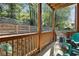 Covered patio with wood columns, fence, and chairs, perfect for outdoor lounging at 482 Pearl Cove Ct, Atlanta, GA 30350