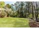 Large backyard with lush lawn and surrounding greenery at 1488 Drayton Woods Dr, Tucker, GA 30084