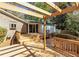 Wooden deck connected to the house, with open beams and mature landscaping at 1488 Drayton Woods Dr, Tucker, GA 30084