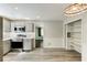 Open kitchen and dining area features grey cabinets, stainless appliances, and modern lighting at 1488 Drayton Woods Dr, Tucker, GA 30084