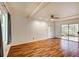 Light-filled living room featuring hardwood floors, sliding glass doors, and recessed lighting at 1488 Drayton Woods Dr, Tucker, GA 30084