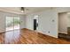 Open living space with hardwood floors and sliding glass door access to outdoor deck at 1488 Drayton Woods Dr, Tucker, GA 30084