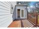 Backyard deck with gray siding and railing, offering an outdoor entertaining space at 1591 Athens Sw Ave, Atlanta, GA 30310