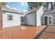 Back of house with an expansive backyard deck, gray siding, and a well-maintained backyard at 1591 Athens Sw Ave, Atlanta, GA 30310