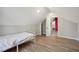 Bedroom featuring sloped ceilings and wood floors at 1591 Athens Sw Ave, Atlanta, GA 30310