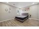 Cozy bedroom with modern decor, light wood floors, and neutral paint at 1591 Athens Sw Ave, Atlanta, GA 30310