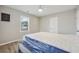 Bright bedroom featuring wood floors, a ceiling fan, and a window letting in natural light at 1591 Athens Sw Ave, Atlanta, GA 30310