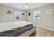 Bright bedroom with two windows, hardwood flooring, and a ceiling fan at 1591 Athens Sw Ave, Atlanta, GA 30310