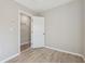 Bedroom with an open door and hardwood floors at 1591 Athens Sw Ave, Atlanta, GA 30310