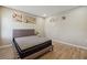 Bedroom showcasing modern decor, light wood floors, and neutral paint at 1591 Athens Sw Ave, Atlanta, GA 30310