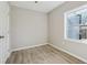 Neutral bedroom with closet door and window providing natural light at 1591 Athens Sw Ave, Atlanta, GA 30310