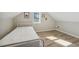 Bedroom featuring sloped ceilings, wood floors and natural light at 1591 Athens Sw Ave, Atlanta, GA 30310
