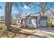 Charming single-Gathering home with gray siding, red front door, and well maintained lawn at 1591 Athens Sw Ave, Atlanta, GA 30310