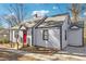 Charming single-Gathering home with gray siding and a bright red front door at 1591 Athens Sw Ave, Atlanta, GA 30310