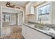 Bright kitchen with granite countertops, stainless steel sink, and white cabinets at 1591 Athens Sw Ave, Atlanta, GA 30310