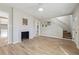 Cozy living room with wood floors, fireplace, and staircase, leading to upper levels at 1591 Athens Sw Ave, Atlanta, GA 30310