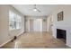 Inviting living room with wood floors, a decorative fireplace, and lots of natural light at 1591 Athens Sw Ave, Atlanta, GA 30310
