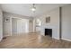 Bright and airy living room with wood floors, a fireplace, and easy access to the kitchen at 1591 Athens Sw Ave, Atlanta, GA 30310