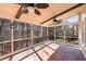 Screened in back porch has ceiling fans and gorgeous views of the surrounding nature at 2405 Millwater Xing, Dacula, GA 30019