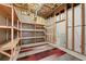 Unfinished basement with shelving, ready for customization or storage at 2405 Millwater Xing, Dacula, GA 30019