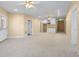 Spacious finished basement with a small kitchenette and white cabinets plus multiple entryways at 2405 Millwater Xing, Dacula, GA 30019