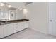 Bathroom featuring double vanity with granite countertop and ample lighting at 2405 Millwater Xing, Dacula, GA 30019