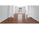 Elegant dining room featuring dark wood floors, white trim, and a stylish chandelier at 2405 Millwater Xing, Dacula, GA 30019