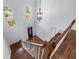 View of the two story entryway with hardwood flooring, stairway with white railings, and chandelier at 2405 Millwater Xing, Dacula, GA 30019