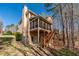 Two-story home featuring a screened in porch, back deck, and landscaped yard at 2405 Millwater Xing, Dacula, GA 30019