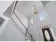 Grand foyer with a staircase, high ceilings, decorative light fixture, and natural light at 2405 Millwater Xing, Dacula, GA 30019