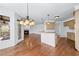 Open kitchen layout with counter seating, fireplace and lots of natural light at 2405 Millwater Xing, Dacula, GA 30019